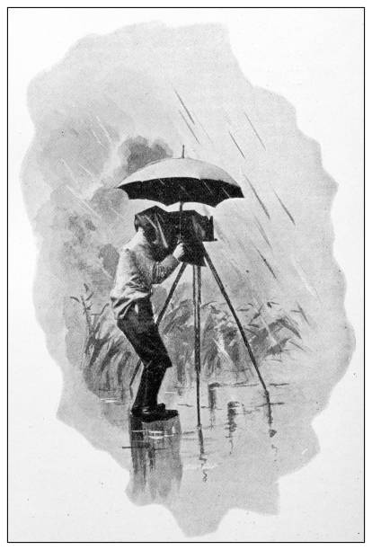 istock Antique dotprinted black and white photograph: Photographer under rain 1292722837