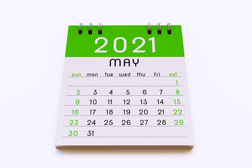 May 2021 calendar note pad page in saturated green colors, isolated on a white background