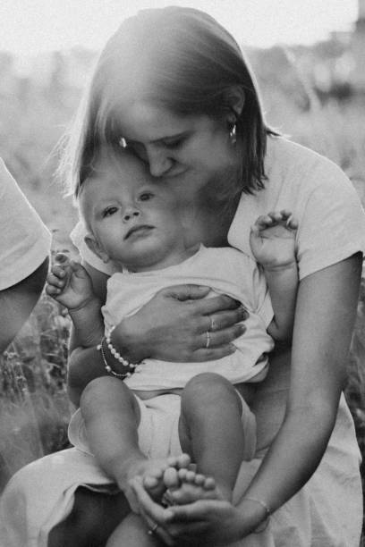 istock Woman playing with her child on the field during sunset. 1292723645