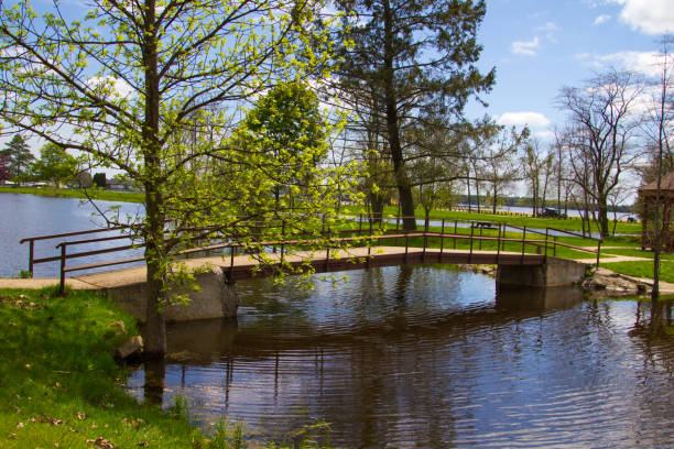 Van Cleve City Park In Gladstone Michigan Pavilion and footbridge over a small pond with a wooden gazebo in the small Upper Peninsula town of Gladstone near Escanaba, Michigan. gladstone michigan photos stock pictures, royalty-free photos & images
