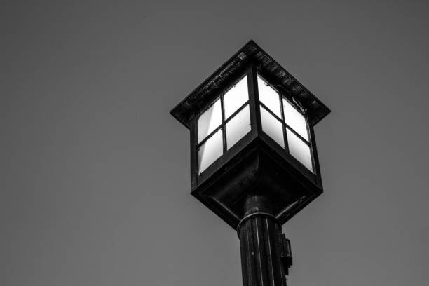 istock Illuminated Black And White Antique Lamp Post 1292727471
