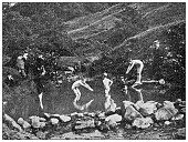 istock Antique dotprinted black and white photograph: Children swimming in pond 1292727610