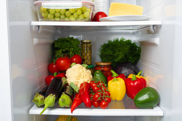 istock Fridge shelf full of fresh vegetables close up 1292728256