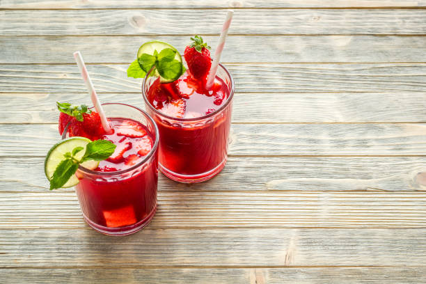 istock Strawberry iced lemonade drink with mint. Cold red coctail 1292728391