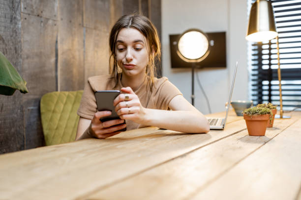 istock Sad woman at home office 1292728444