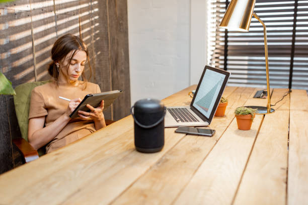 istock Woman working at cozy home office 1292728602