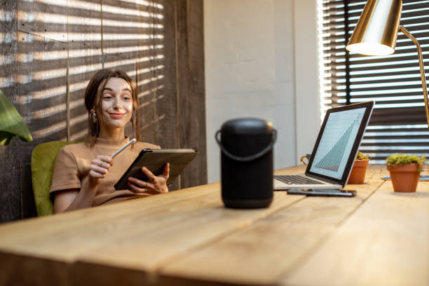 istock Woman talking to the smart speaker indoors 1292728611