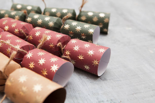 istock Matt paper Christmas crackers on a grey wooden surface 1292730782