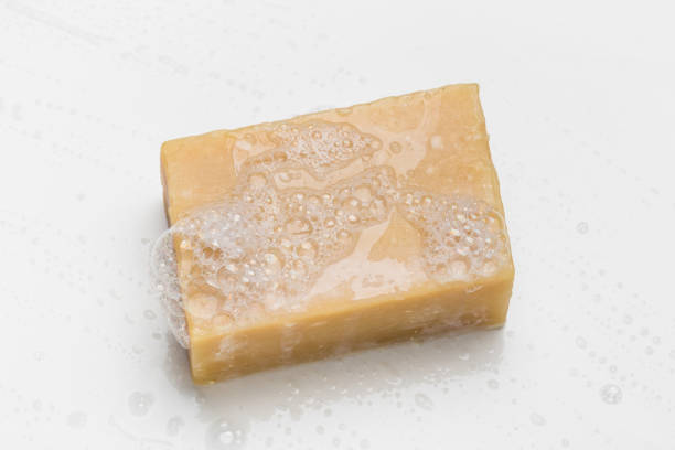 istock Soap bar and foam on white background 1292730862
