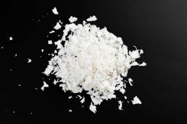 istock a pile of poured white artificial synthetic snow on a black background 1292730897