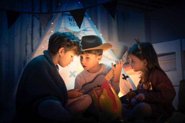 istock Cute kids play camping in kids room 1292731993
