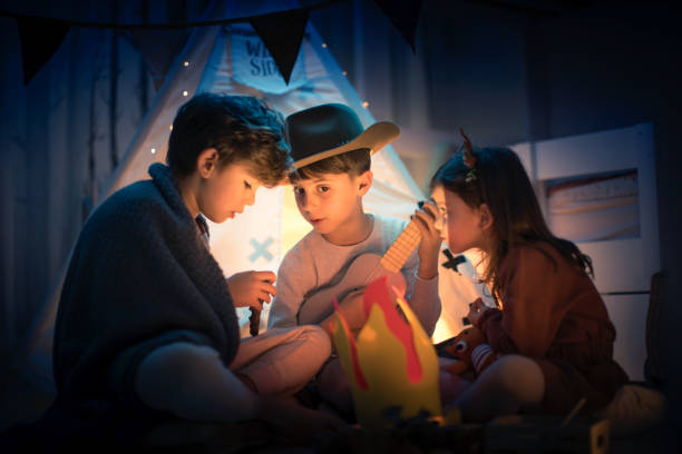 istock Cute kids play camping in kids room 1292732007