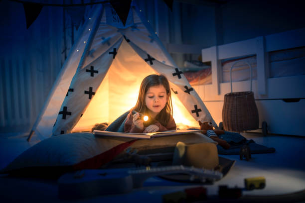 Cute kids play camping in kids room