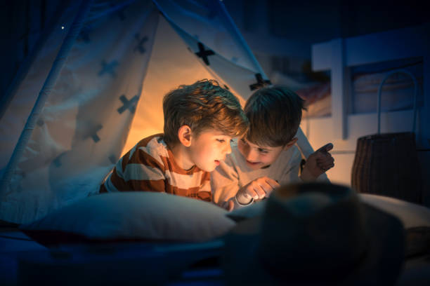 istock Cute kids play camping in kids room 1292732062