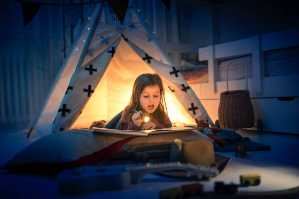 istock Cute kids play camping in kids room 1292732069
