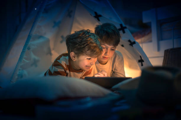 istock Cute kids play camping in kids room 1292732074