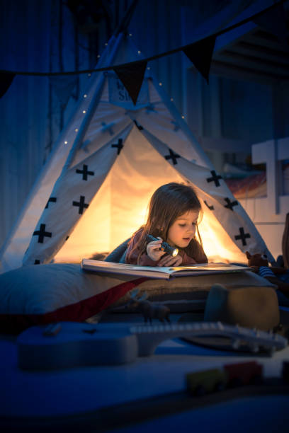 istock Cute kids play camping in kids room 1292732081