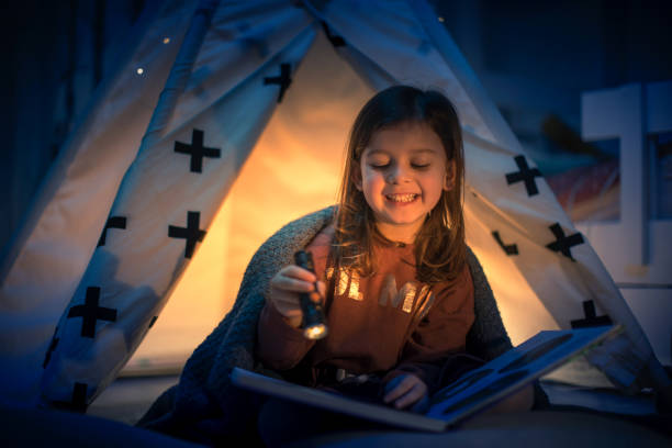 istock Cute kids play camping in kids room 1292732082