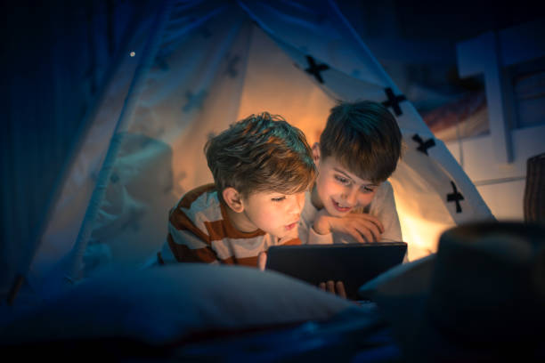 istock Cute kids play camping in kids room 1292732085