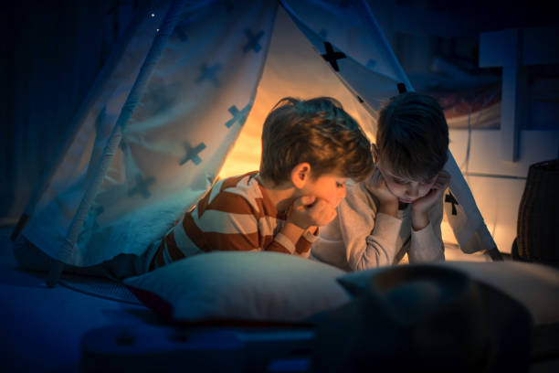 istock Cute kids play camping in kids room 1292732128