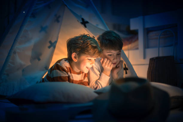istock Cute kids play camping in kids room 1292732132