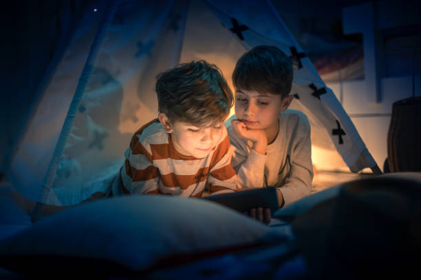 istock Cute kids play camping in kids room 1292732154