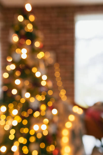 istock Bokeh lights of christmas tree, blurred christmas tree at house 1292733132
