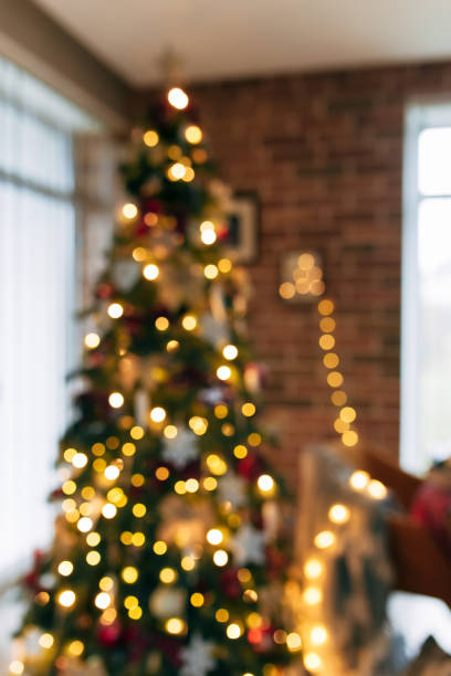 istock Bokeh lights of christmas tree, blurred christmas tree at house 1292733134