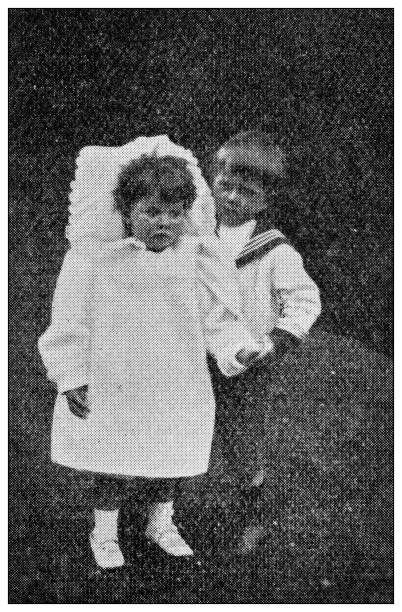 istock Antique dotprinted black and white photograph: Children couple 1292733152