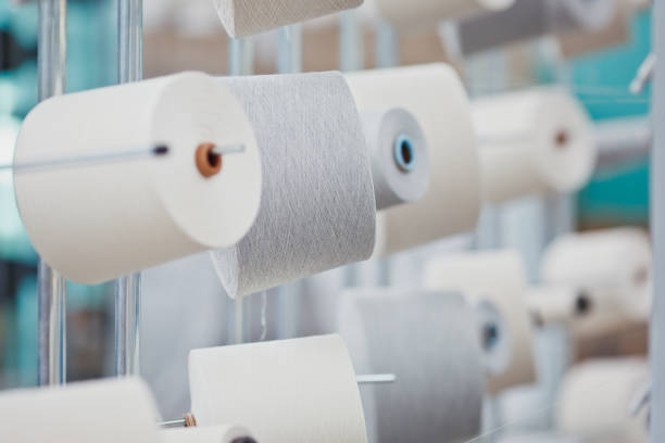 Textile Manufacturing. Circular knitted fabric. Textile factory in spinning production line and a rotating machinery and equipment production company. Clothing industry. Manufacturing textile fabrics. stock photo