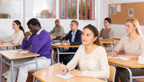 istock Young woman working during group business training 1292734735