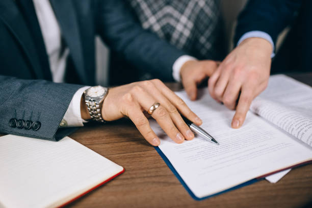 istock Business close-up of hands and documents 1292735269
