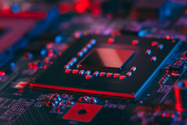 istock Hardware technology concept in neon light. Motherboard in blue-red light. 1292735480