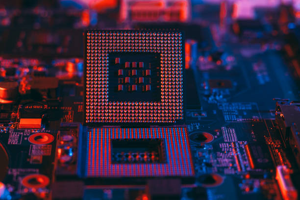 istock Hardware technology concept in neon light. Motherboard in blue-red light. 1292735493