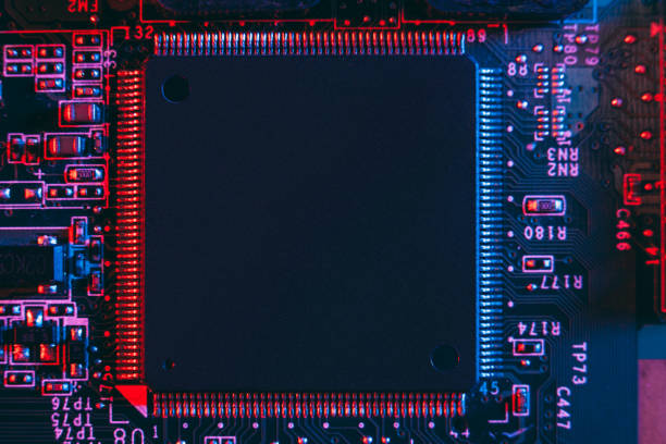 istock Hardware technology concept in neon light. Motherboard in blue-red light. 1292735596