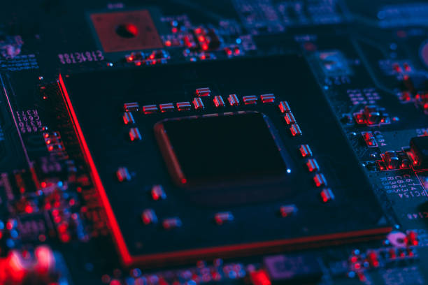 istock Hardware technology concept in neon light. Motherboard in blue-red light. 1292735617