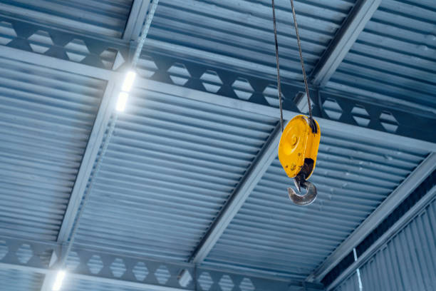 istock Industrial crane hook in a modern factory building 1292736253