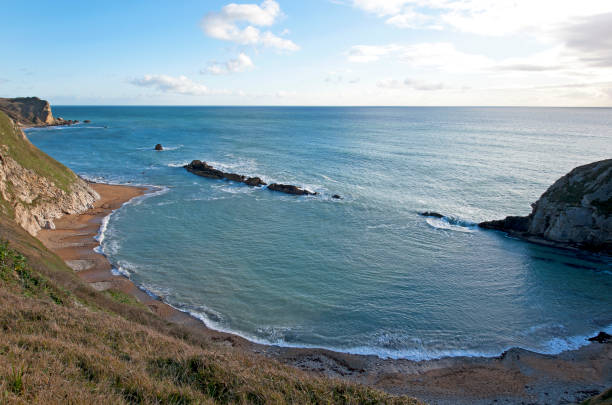 istock Eroded bay formation on the Jurassic Coast, Dorset, England 1292736515