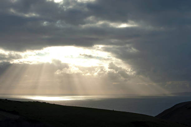 istock Sunburst landscape on the Jurassic Coast, Dorset, England 1292736870