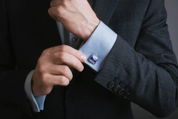 istock hand men wears cufflinks close up 1292738726