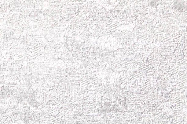 istock Texture of white wallpaper with relief and corrugated pattern. Paper background. 1292739069