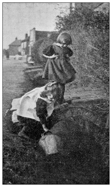 istock Antique dotprinted black and white photograph: Children outdoors 1292739152