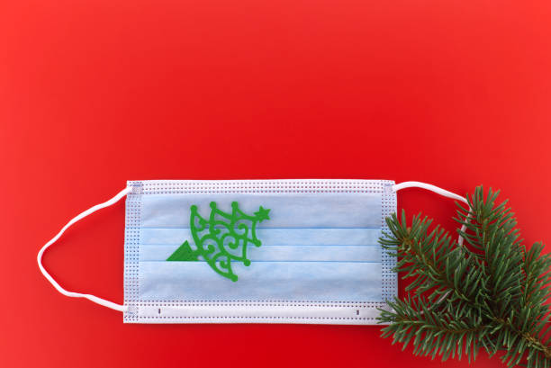 istock Face mask with paper cut Christmas tree 1292739171