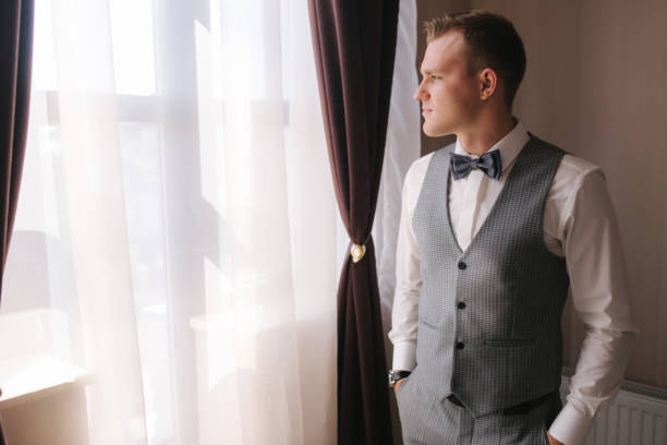istock Handsome groom dressed in hotel. Wedding day 1292739957