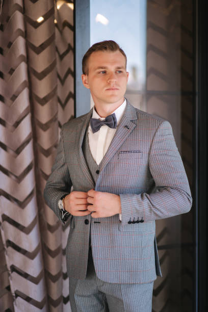 istock Handsome groom dressed in hotel. Wedding day 1292739982