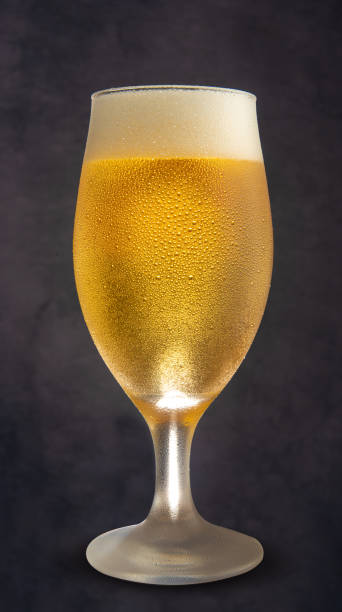 istock Beer, glass of cold beer with blue gradient background, selective focus. 1292740004
