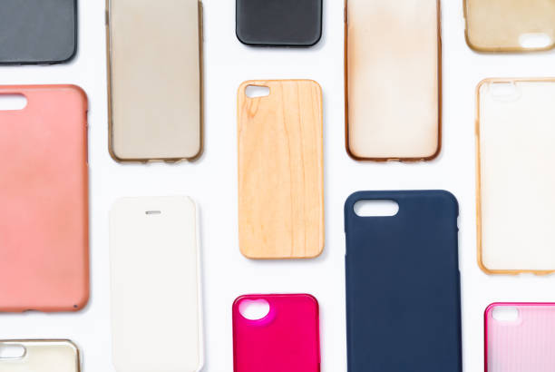 istock Pile of multicolored plastic back covers for mobile phone. Choice of smart phone protector accessories on white background. A lot of silicone phone backs or skins next to each other 1292740124