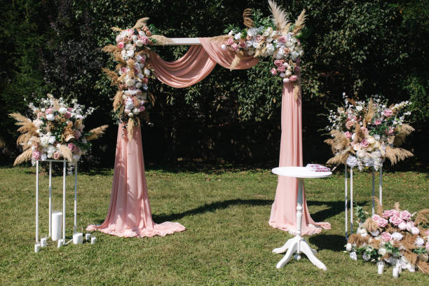 istock Wdding arch on ceremony outdoors. summer time 1292740197