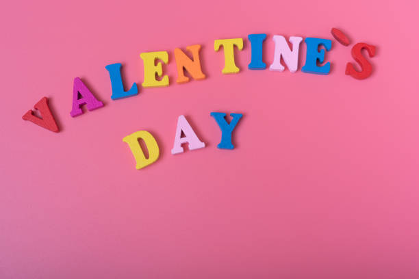 istock The word Valentine's day on a pink background. 1292741248