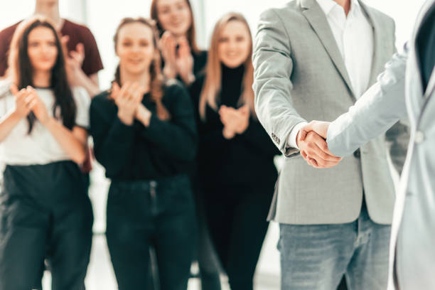 istock close up. business people greet each other 1292743411